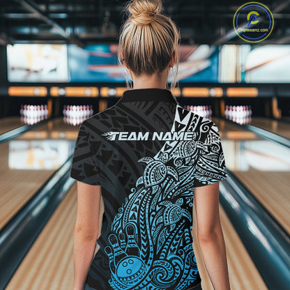 Back view of a female model in a black and blue bowling quarter-zip shirt displaying Polynesian bowling artwork and swirls.