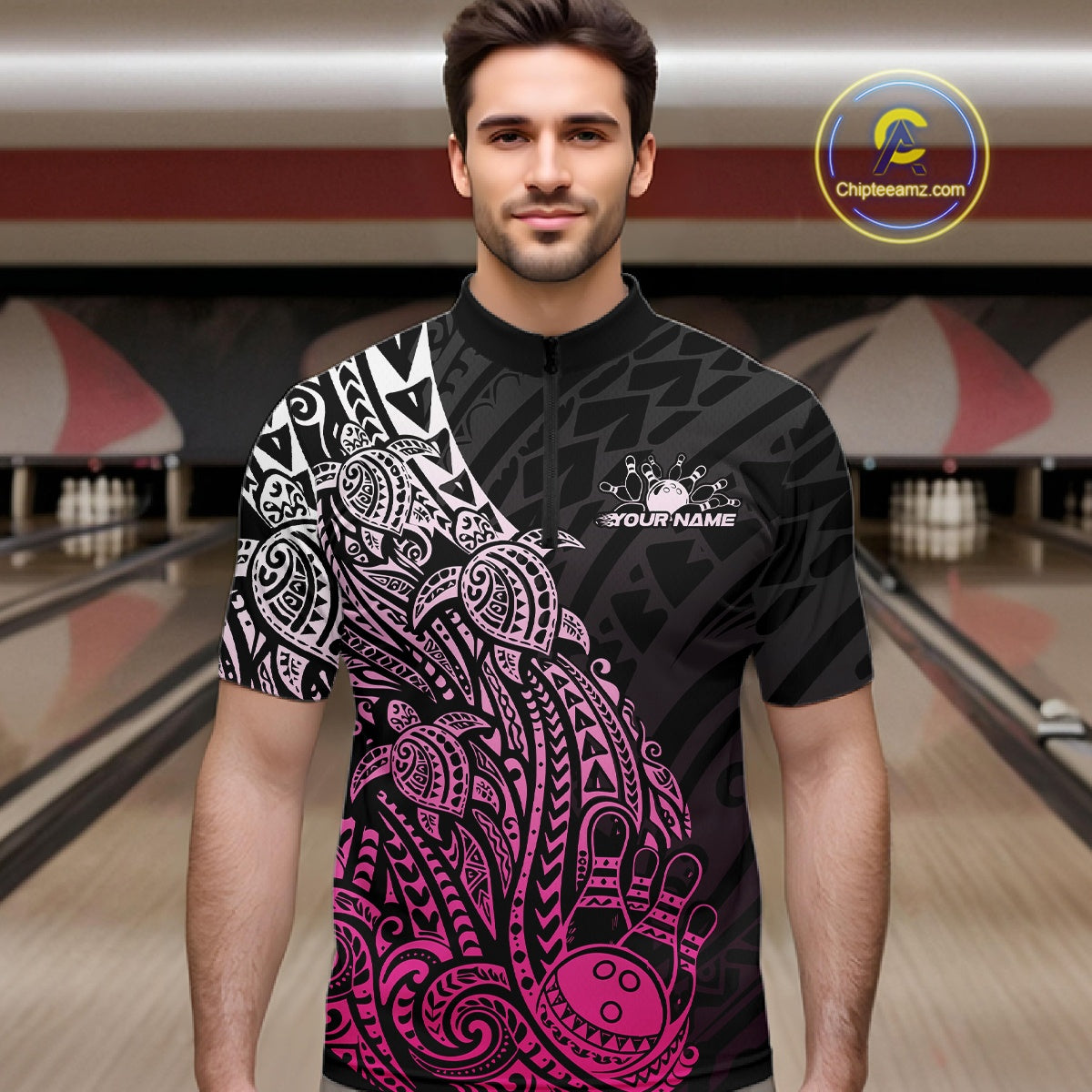 Male model wearing a black and pink bowling quarter-zip shirt at the lane with Polynesian-inspired bowling motifs.