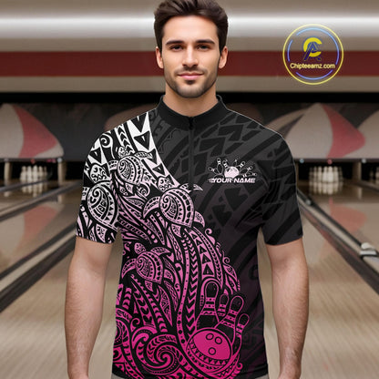 Male model wearing a black and pink bowling quarter-zip shirt at the lane with Polynesian-inspired bowling motifs.