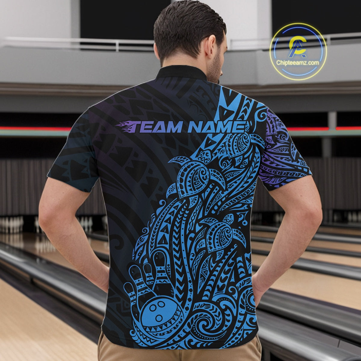 Front view of a male model in a black, blue, and purple bowling quarter-zip shirt featuring Polynesian bowling motifs and swirl accents.
