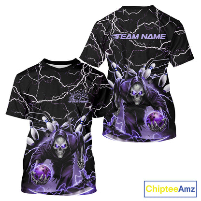 Front and back views of a black short-sleeve t-shirt featuring a purple and white graphic of a hooded skull character with lightning bolts, holding a glowing purple orb. The front has placeholder text 'YOUR NAME' and 'TEAM NAME', and the back has 'TEAM NAME' at the shoulders.