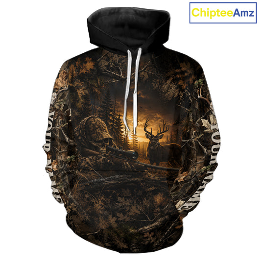 A pullover hoodie featuring an all-over camouflage and hunting scene print with a deer, forest, and a skull motif, shown on a plain white background. A 'ChipteeAmz' logo is visible in the top right corner.