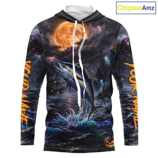 A long-sleeve hoodie with an all-over Halloween-themed graphic print featuring a jumping fish under a full moon, dark stormy sky, lightning, and orange text on the sleeves. The hoodie has a white drawstring and is shown on a plain white background with a ChipteeAmz logo in the top right corner.