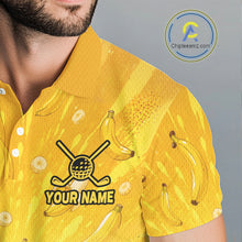 Load image into Gallery viewer, Yellow shirt with banana pattern and customizable text on a gray background