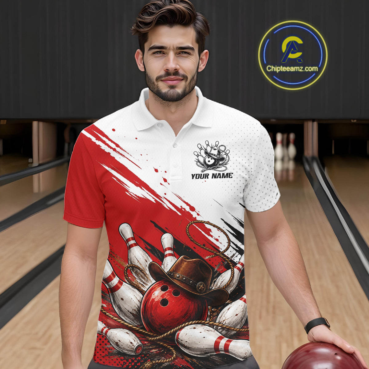 A man wearing a custom bowling-themed polo shirt with a red and white design featuring bowling pins, balls, and a cowboy hat, standing in a bowling alley.