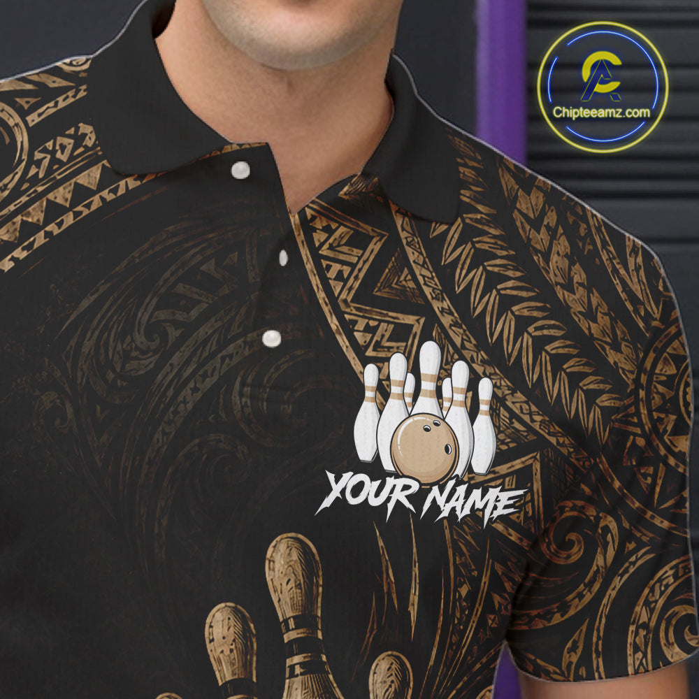 A close-up of a man wearing a black short-sleeve polo shirt with a gold tribal pattern and a bowling-themed graphic with the text 'YOUR NAME'.