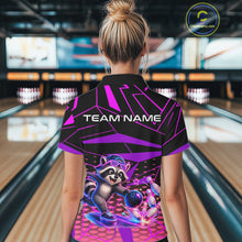 Load image into Gallery viewer, Person wearing a bowling shirt with a raccoon graphic and 'TEAM NAME' text in a bowling alley.