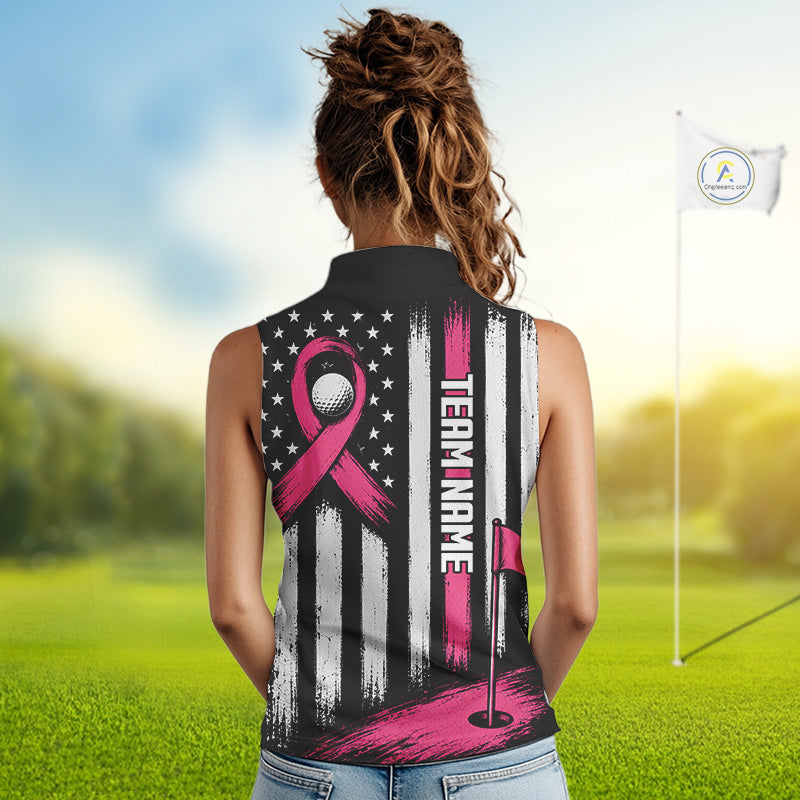 A woman viewed from behind wearing a sleeveless collared golf shirt with a custom pink and white graphic design featuring a ribbon, stars, stripes, and 'TEAM NAME' text, set against a blurred golf course background.