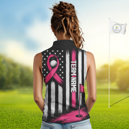A woman viewed from behind wearing a sleeveless collared golf shirt with a custom pink and white graphic design featuring a ribbon, stars, stripes, and 'TEAM NAME' text, set against a blurred golf course background.