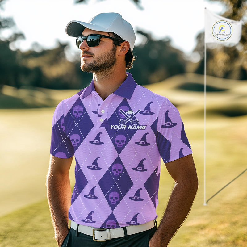 A man wearing a purple and lavender argyle golf shirt with skull and witch hat patterns, a white cap, and sunglasses, standing on a golf course with a flag in the background.