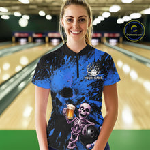 Load image into Gallery viewer, Person wearing a blue and black bowling shirt with a skeleton design in a bowling alley.