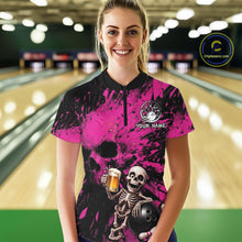 Load image into Gallery viewer, Person wearing a pink and black bowling shirt with a skeleton design in a bowling alley.