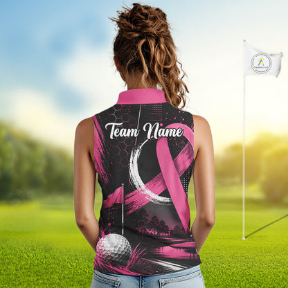 A woman viewed from behind wearing a sleeveless black and pink polo shirt with a golf theme and a pink awareness ribbon design, standing on a golf course with a flag in the background.