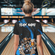 Load image into Gallery viewer, Person wearing a black and blue bowling shirt with a skeleton design in a bowling alley.