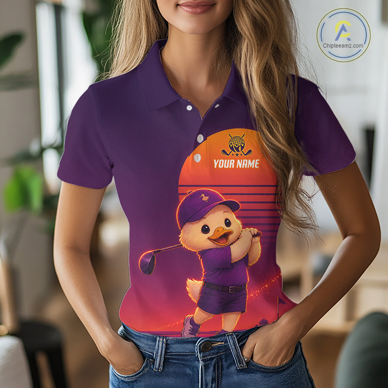 Person wearing a purple polo shirt with a cartoon duck design and customizable text.