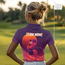 Load image into Gallery viewer, Person wearing a purple golf shirt with a flamingo graphic and 'Team Name' text on a golf course.