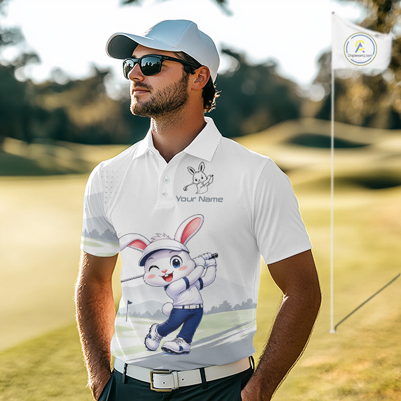Man wearing a white polo shirt with a cartoon character on a golf course
