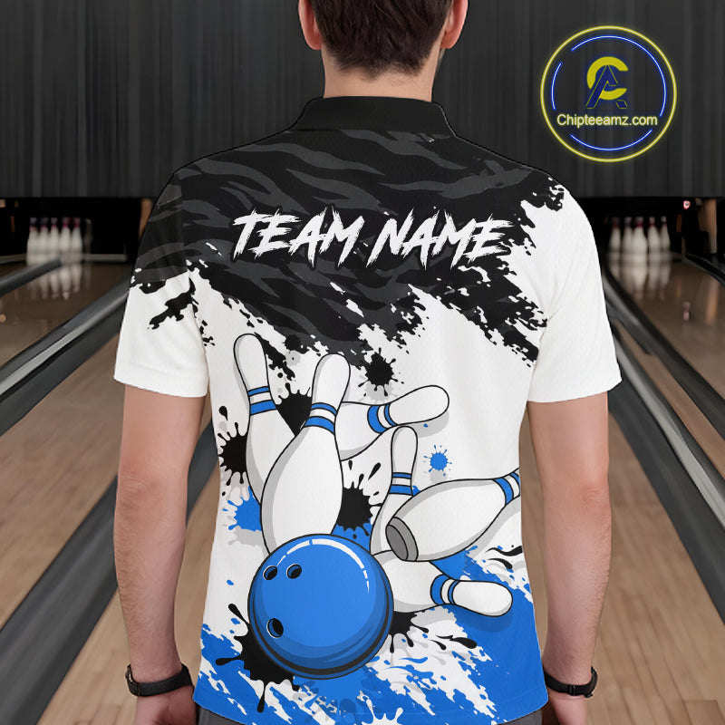 A person viewed from behind wearing a custom bowling-themed short-sleeve polo shirt. The back of the shirt features a white base with a black brushstroke pattern at the top, the text 'TEAM NAME' in white, and a graphic of falling bowling pins and a blue bowling ball at the bottom.