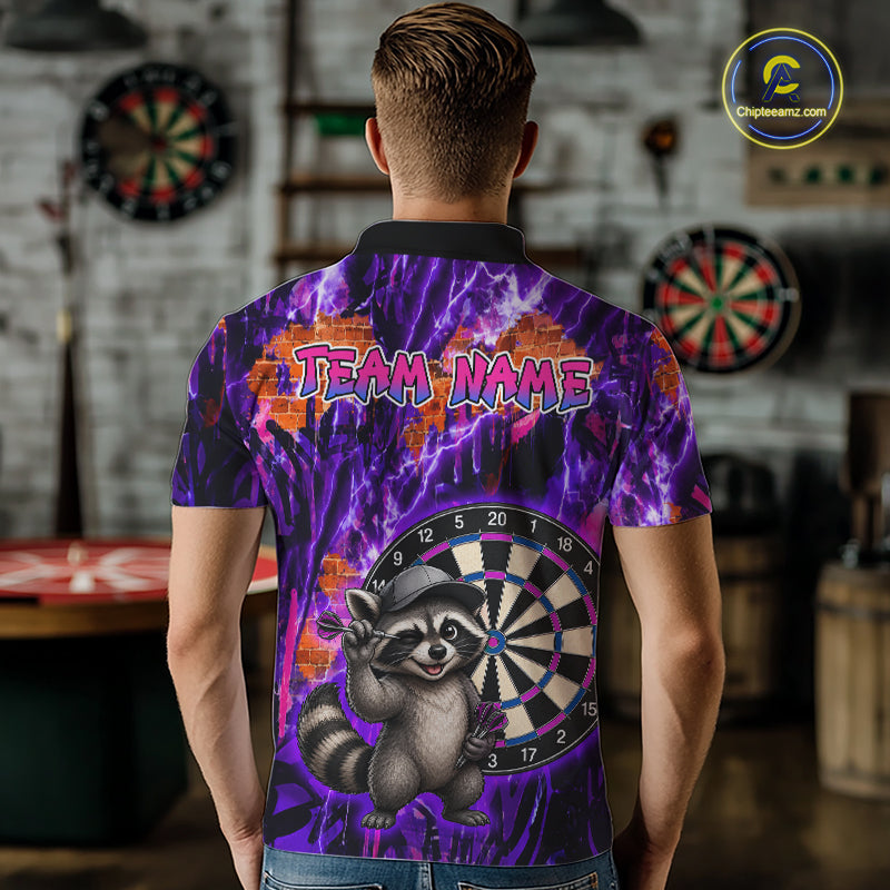 Person wearing a colorful shirt with a raccoon and dartboard design, standing in a room with dartboards.
