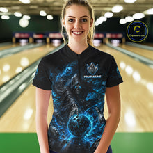 Load image into Gallery viewer, Person wearing a black t-shirt with a blue graphic design and 'TEAM NAME' text in a bowling alley.