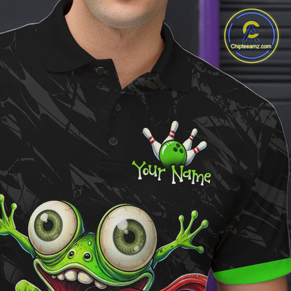 A close-up of a person wearing a black short-sleeve polo shirt with a colorful bowling-themed graphic on the chest, including a green bowling ball, white pins, and a cartoon frog. The shirt has a custom text placeholder reading 'Your Name' and a visible Chipteeamz.