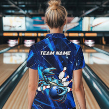 Load image into Gallery viewer, Person wearing a blue bowling shirt with a design and 'TEAM NAME' text in a bowling alley.
