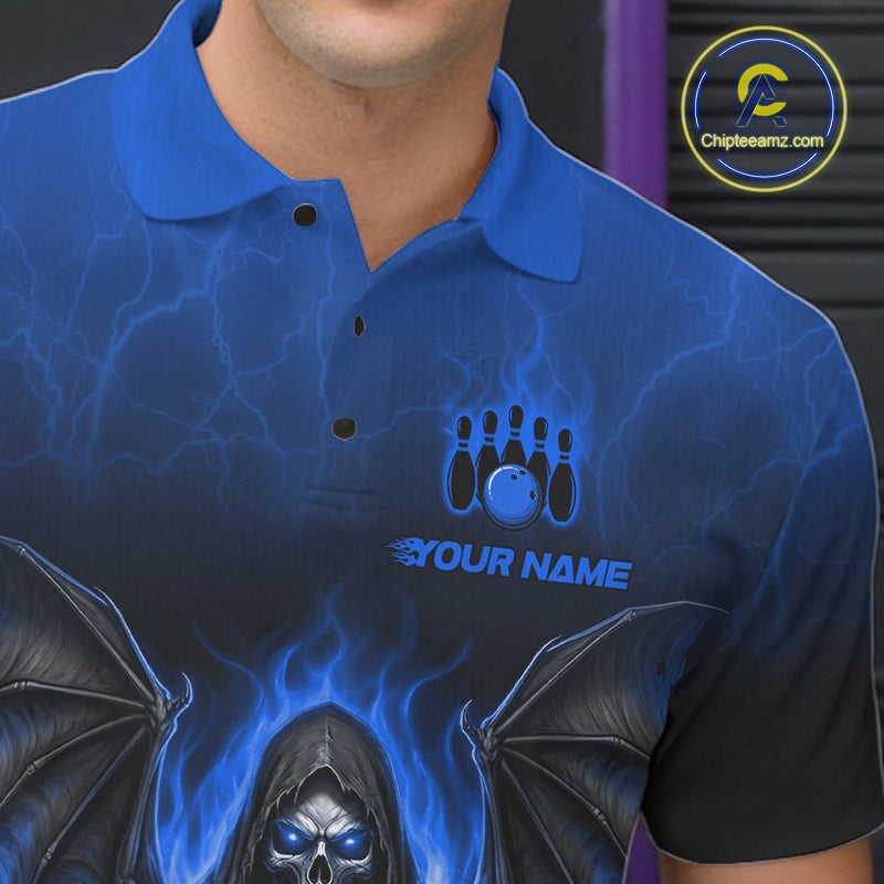 A close-up of a person wearing a blue short-sleeve polo shirt with a dark graphic design featuring lightning, bowling pins, a bowling ball, the text 'YOUR NAME', and a grim reaper with wings and blue flames. 