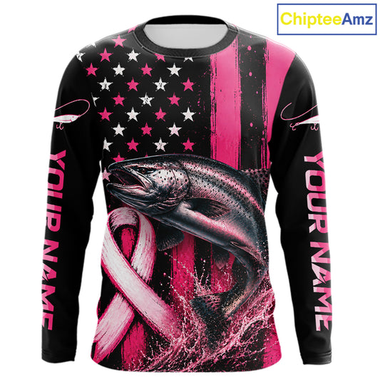 A long-sleeve black shirt with a pink and white patriotic fishing graphic, featuring a salmon, an American flag with stars, a pink ribbon, and 'YOUR NAME' printed down both sleeves. A 'ChipteeAmz' logo is visible in the top right corner.