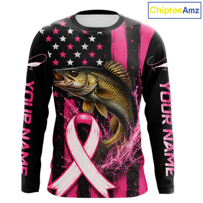 A long-sleeve custom graphic shirt featuring a large bass fish, a pink awareness ribbon, and a black-and-pink American flag design. The sleeves have placeholder text reading 'YOUR NAME' and a 'ChipteeAmz' logo appears in the top right corner.