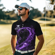 Load image into Gallery viewer, Man wearing a black golf shirt with a purple graphic design on a golf course