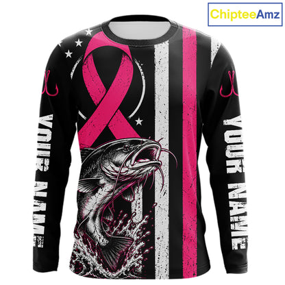A long-sleeve black shirt with a pink ribbon, a fish graphic, vertical white and pink stripes, and placeholder text on the sleeves. The ChipteeAmz logo is visible in the top right corner.
