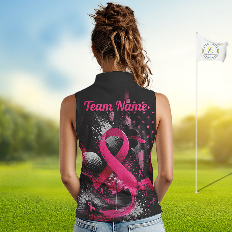 A woman viewed from behind wearing a sleeveless black polo shirt with a pink and white golf-themed graphic design featuring a large pink ribbon, golf ball, stars, and the text 'Team Name'. The background shows a blurred golf course with a flagstick.