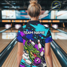 Load image into Gallery viewer, Person wearing a colorful bowling shirt with a dragon design in a bowling alley.