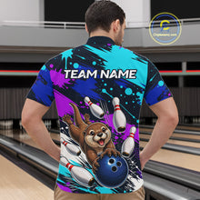 Load image into Gallery viewer, Person wearing a colorful bowling-themed shirt with an otter and bowling pins design, standing in a bowling alley.
