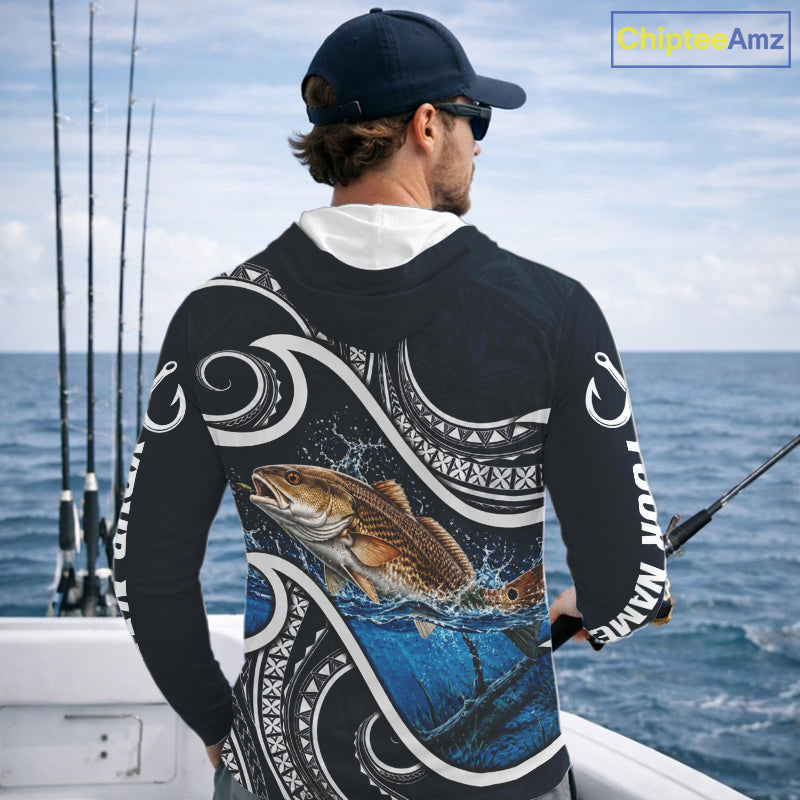 Angler wearing blue tribal pattern custom redfish long sleeve hooded fishing shirt on the water