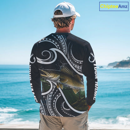 Angler wearing blue tribal pattern custom walleye long sleeve fishing shirt on the water 