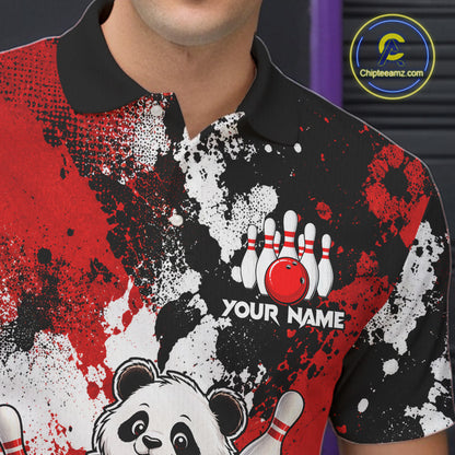 A close-up of a person wearing a short-sleeve polo shirt with a bold red, black, and white splatter graphic, a black collar