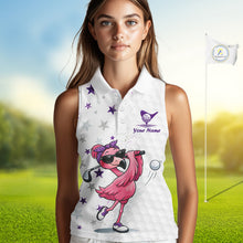 Load image into Gallery viewer, Woman wearing a white sleeveless golf shirt with a pink flamingo design on a golf course.