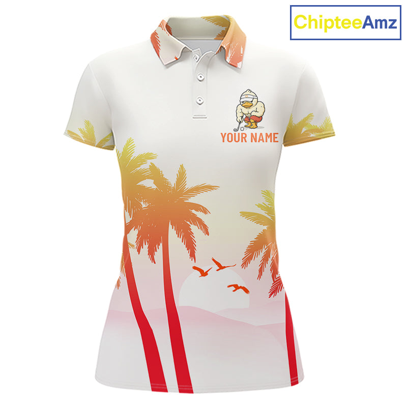 Front view of funny duck golf polo shirt for women with tropical sunset print