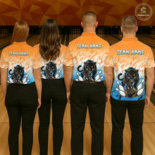 Load image into Gallery viewer, Bowling team wearing matching custom orange and blue leopard league shirts with personalized names