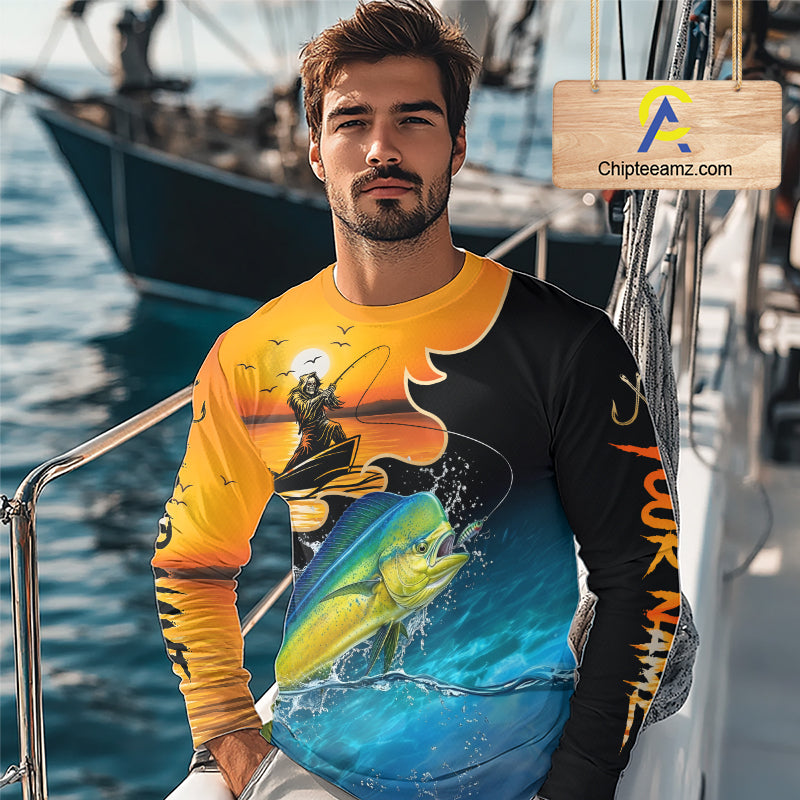 Man wearing a colorful mahi mahi fishing-themed shirt on a boat with water and another boat