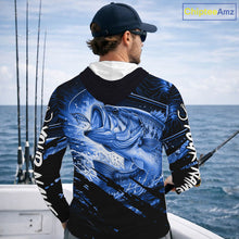 Load image into Gallery viewer, Person wearing a blue and black bass fishing shirt with a fish design, standing by the ocean.