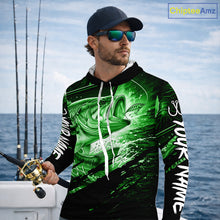 Load image into Gallery viewer, Man wearing a long sleeve hooded fishing shirt with a green bass fish design on a boat