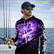 Load image into Gallery viewer, Man wearing a long sleeve hooded fishing shirt with a purple bass fish design on a boat