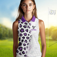 Load image into Gallery viewer, Woman wearing a white sleeveless golf shirt with purple leopard print on a golf course.