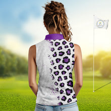 Load image into Gallery viewer, Woman wearing a sleeveless shirt with purple leopard print design on a golf course.