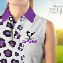 Load image into Gallery viewer, Close up of a sleeveless shirt with a golf themed design and 'Your Name' text on a blurred golf course background.