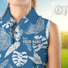 Load image into Gallery viewer, Blue sleeveless shirt with white leaf patterns and 'YOUR NAME' text on a blurred outdoor background