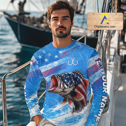 Man wearing a blue patriotic bass fishing shirt with custom name, standing on a boat