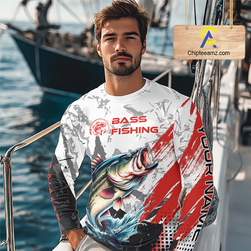 A fisher man wearing a bass fishing shirt long sleeve with personalized name, sitting on a boat